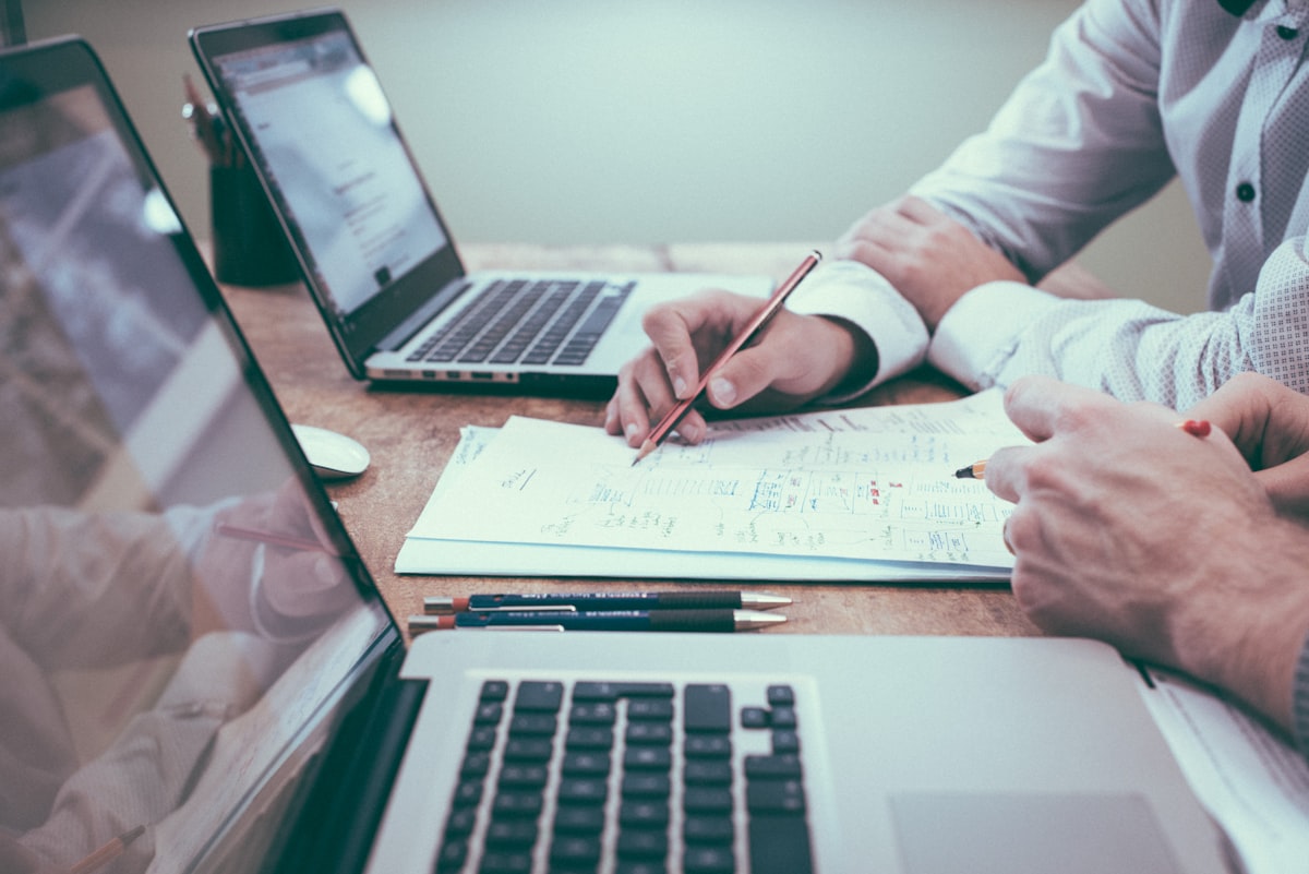Meeting table where clients review long-term savings worksheets